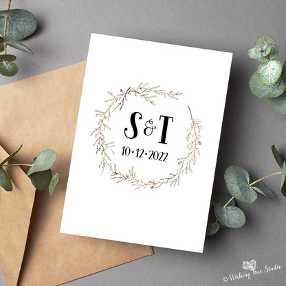 Wedding card with couple's initials
